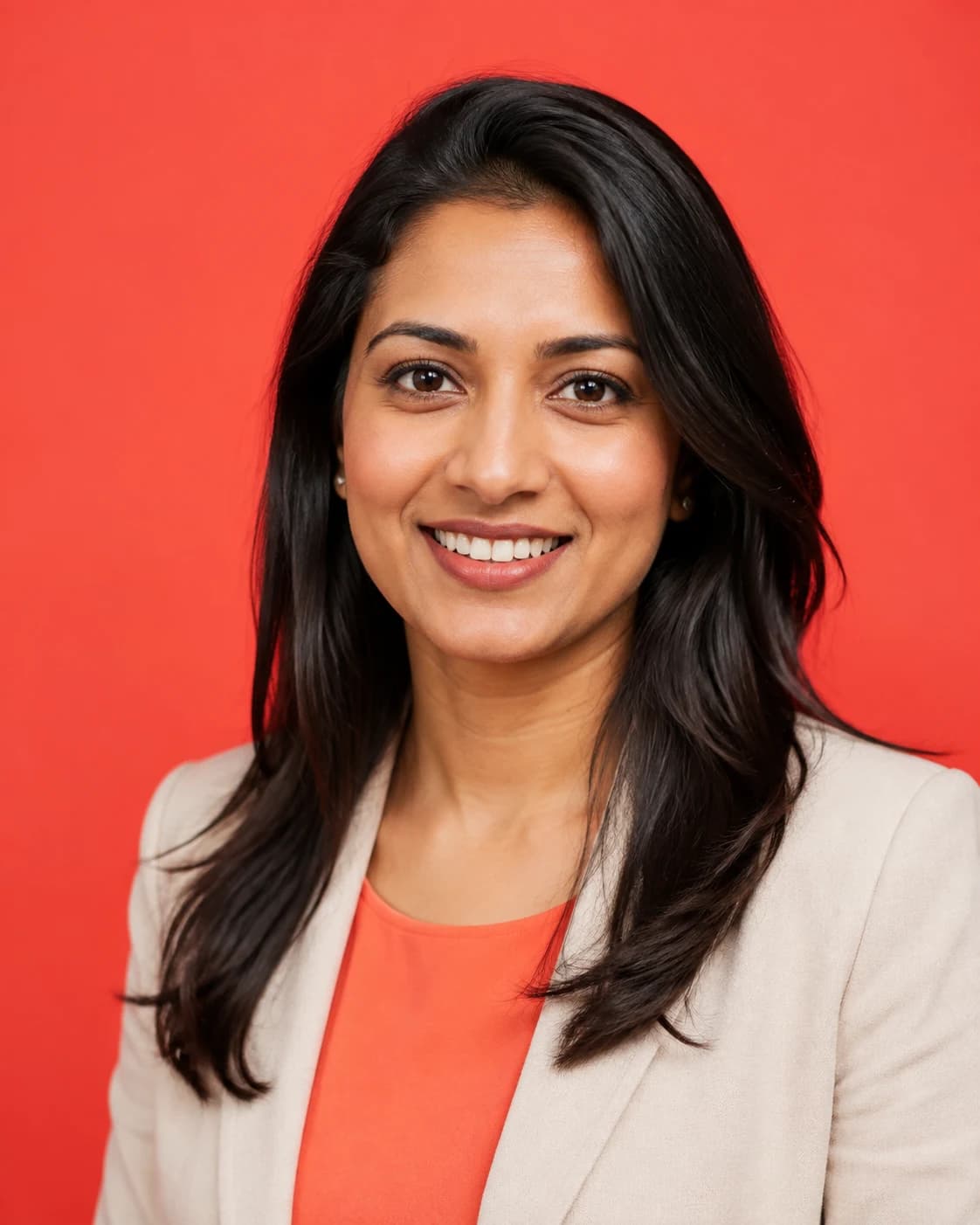 Polished event headshot of a South Asian product leader with modern editorial lighting