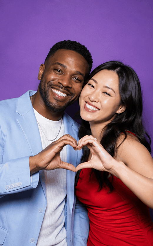 Animated GIF booth loop of a Black man and East Asian woman making four synchronized poses against a violet backdrop