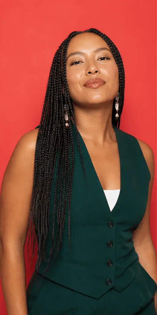 Animated GIF booth loop of an Indigenous woman making four fashion-forward poses against a coral backdrop